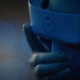 Doctor Manhattan removing one of the masks he wears.